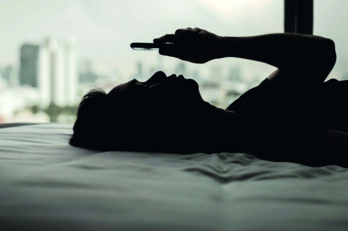 Asian,Man,Feels,Sad,On,Bed,Looking,And,Focus,On
